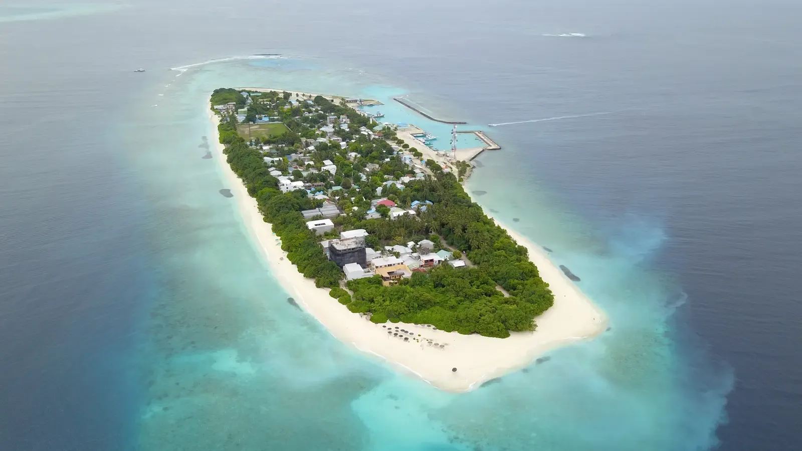 Aerial view of Ukulhas island surrounded by turquoise lagoon in the Maldives
